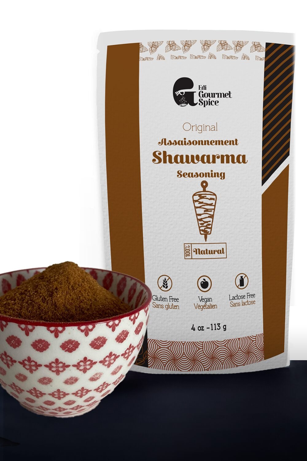 Shawarma seasoning pouch beside a bowl of the ground blend
