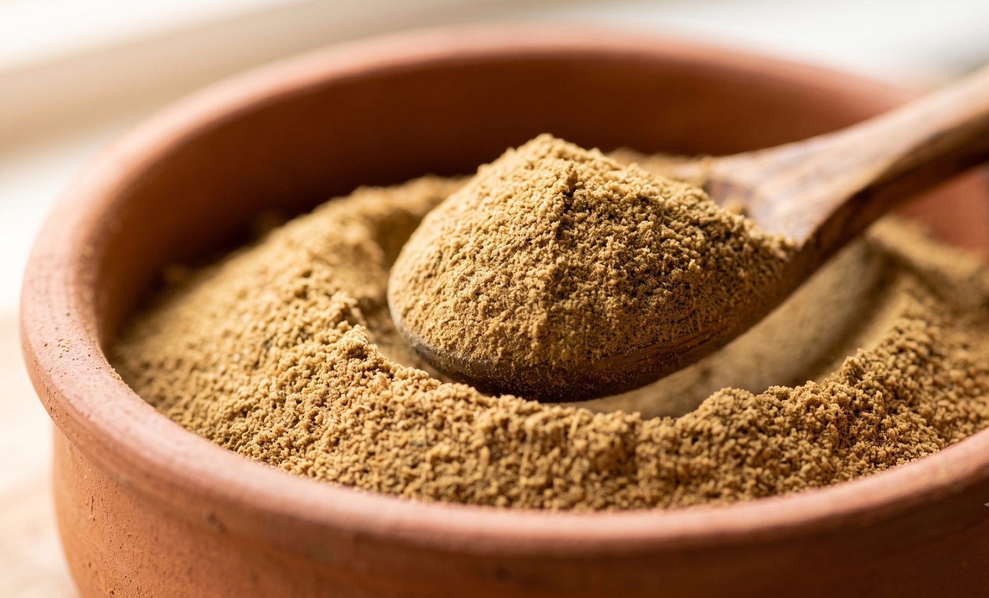 Close-up of finely ground Turkish za'atar heaped on a wooden spoon